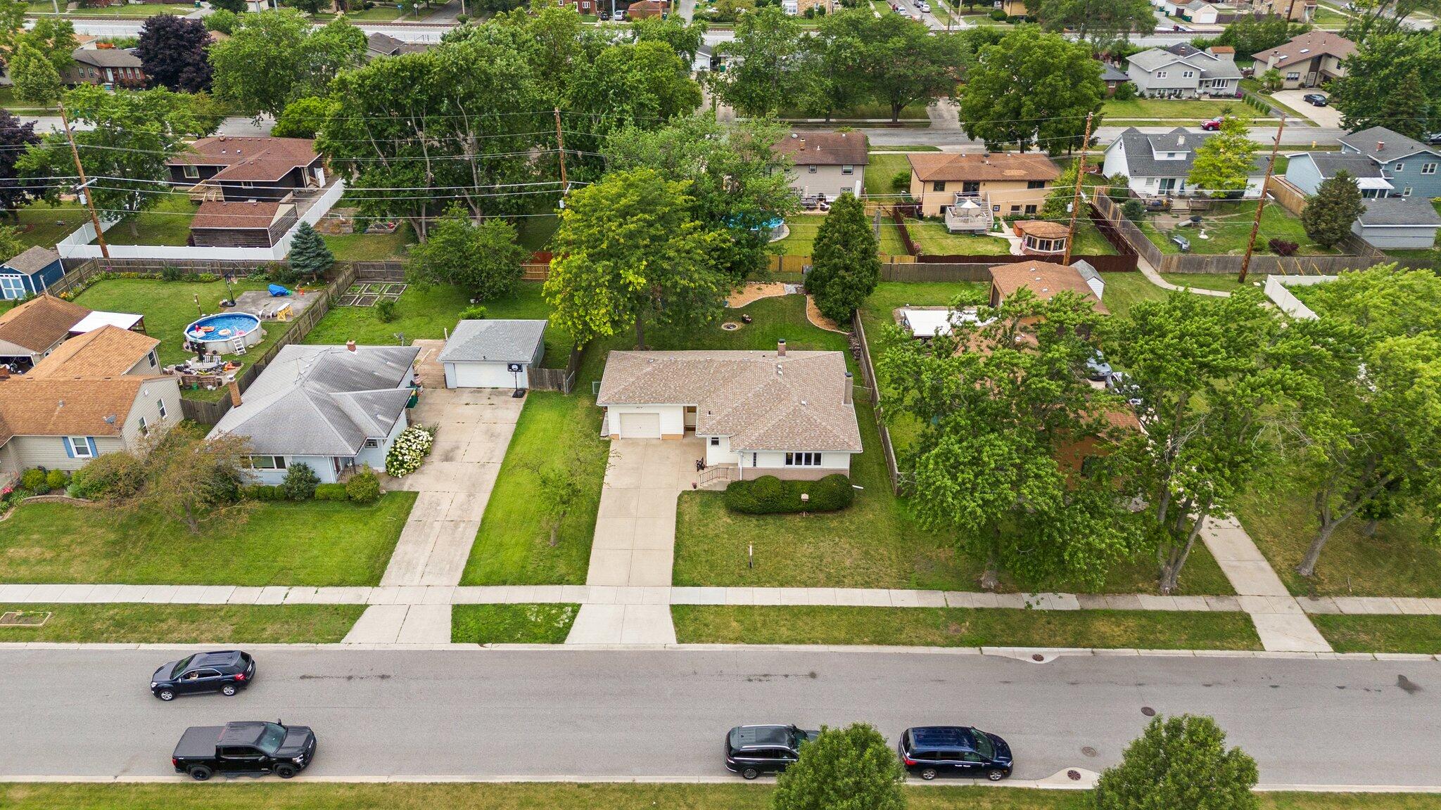 8014 Harrison Avenue Munster, IN 46321 - Photo 33 of 37 an aerial view of a house with a yard and lake view