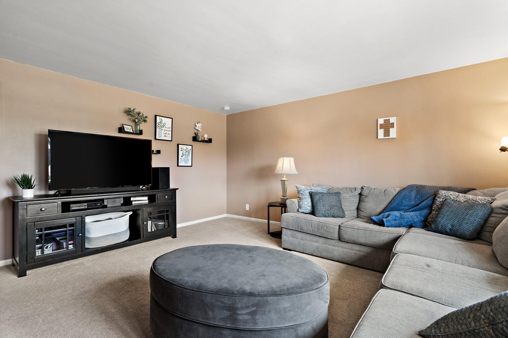 8014 Harrison Avenue Munster, IN 46321 - Photo 6 of 37 a living room with furniture and a flat screen tv