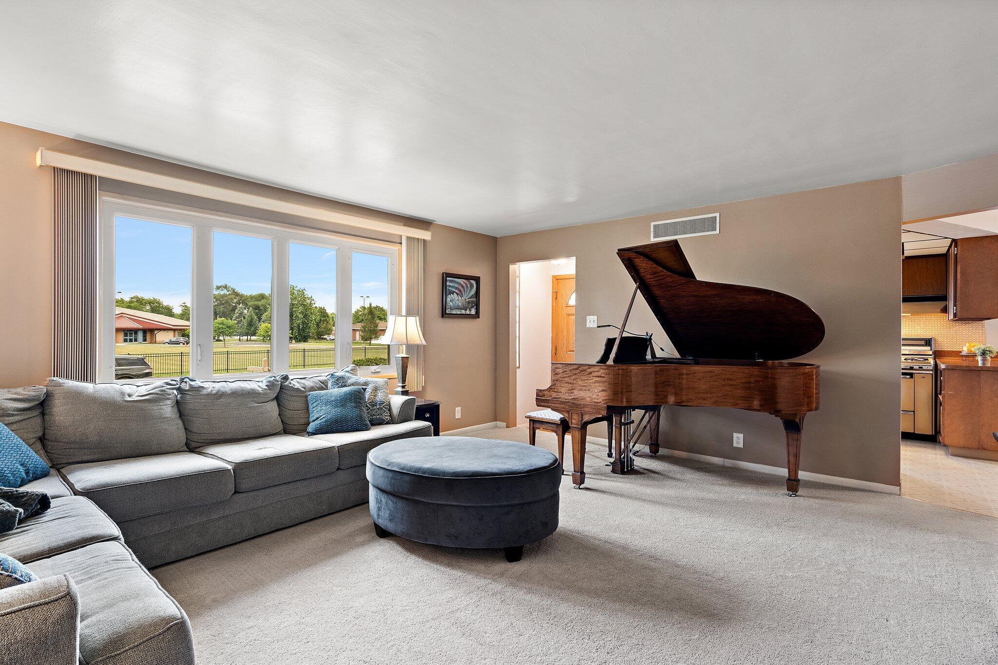 8014 Harrison Avenue Munster, IN 46321 - Photo 7 of 37 a living room with furniture and a large window