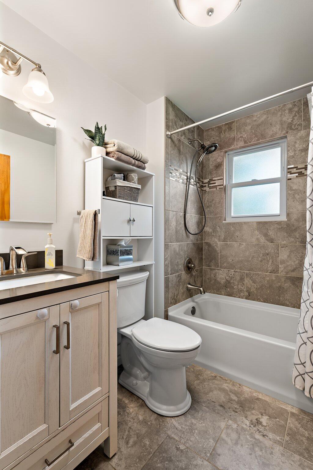8014 Harrison Avenue Munster, IN 46321 - Photo 9 of 37 a bathroom with a granite countertop sink toilet and shower