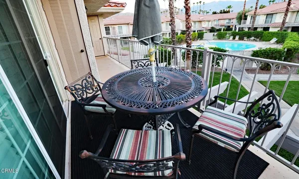 a view of balcony with furniture and tub