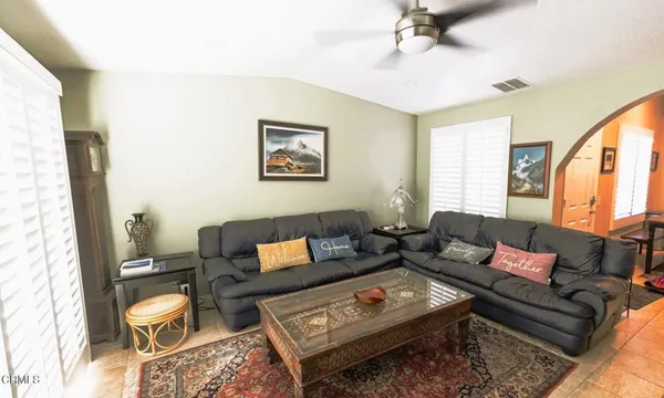 a living room with furniture and a window