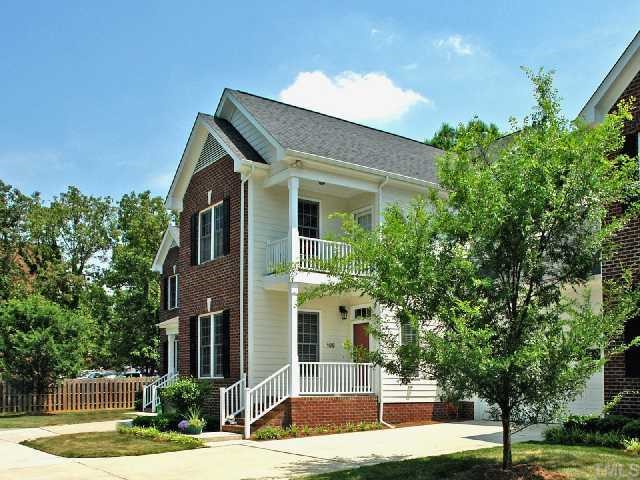 2201 Tallon Hall Court, Unit 105 Raleigh, NC 27607 - Photo 1 of 12 a view of house with yard in front of it