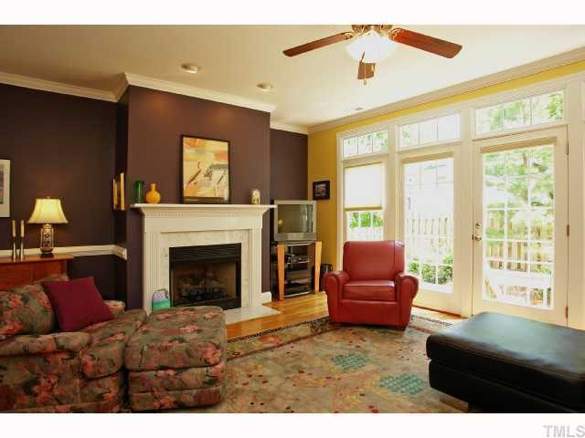 2201 Tallon Hall Court, Unit 105 Raleigh, NC 27607 - Photo 3 of 12 a living room with furniture and a fireplace