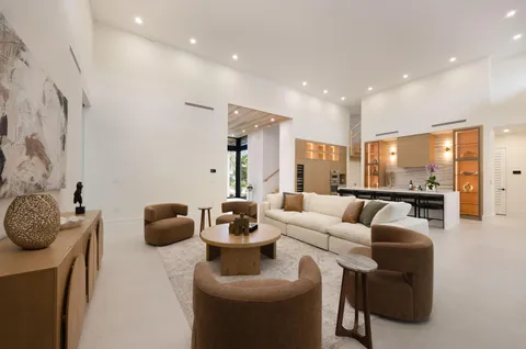 a bedroom with a large bed and a large window