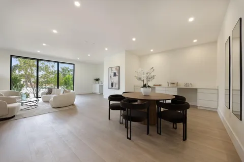 a kitchen with stainless steel appliances a sink stove and refrigerator