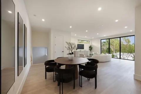 a kitchen with a refrigerator and a sink