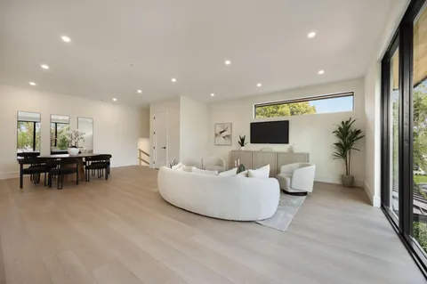 a bathroom with a double vanity sink toilet and shower