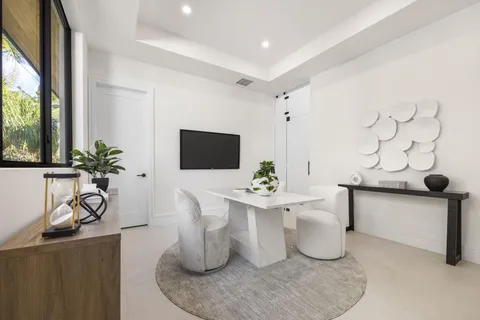 a bathroom with a toilet a sink and a mirror