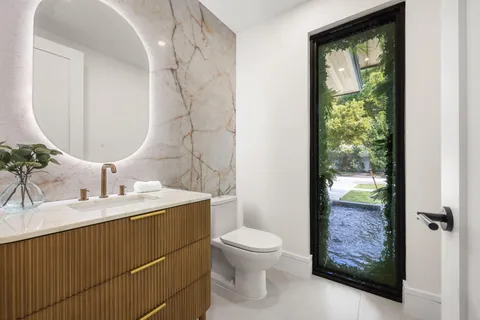 a view of a house with backyard and porch