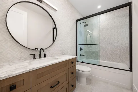 a view of a house with a yard and garage