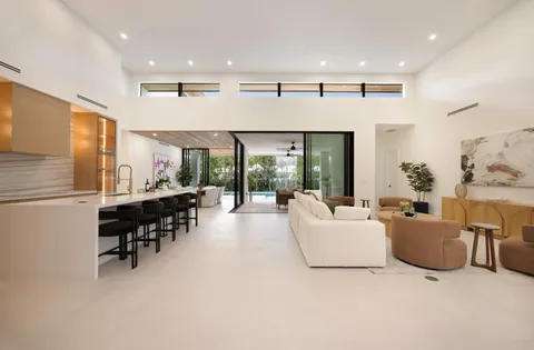 a view of a hallway with windows and entryway