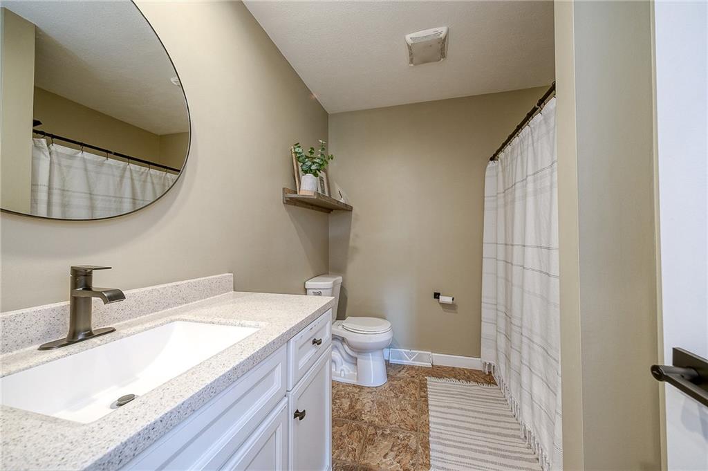 667 Ridge Road Georgetown, PA 15043 - Photo 18 of 27 a bathroom with a granite countertop sink and a mirror