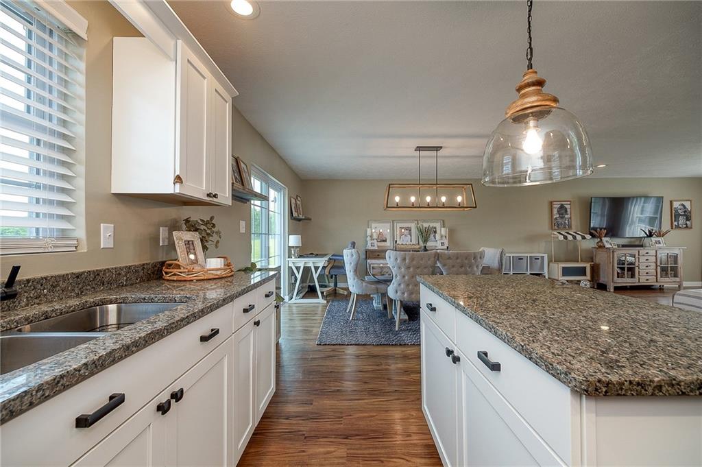 667 Ridge Road Georgetown, PA 15043 - Photo 7 of 27 a kitchen with stainless steel appliances granite countertop a sink stove and refrigerator