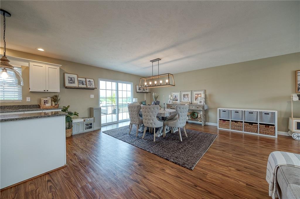 667 Ridge Road Georgetown, PA 15043 - Photo 8 of 27 a view of a dining room with furniture window and wooden floor