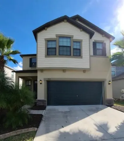 a front view of a house with yard