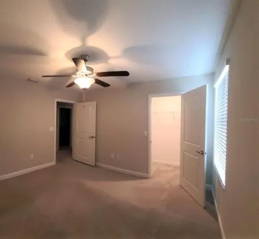 a view of a storage and utility room with a window