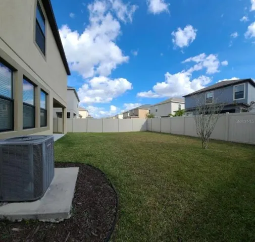 a view of outdoor space with signage and flags
