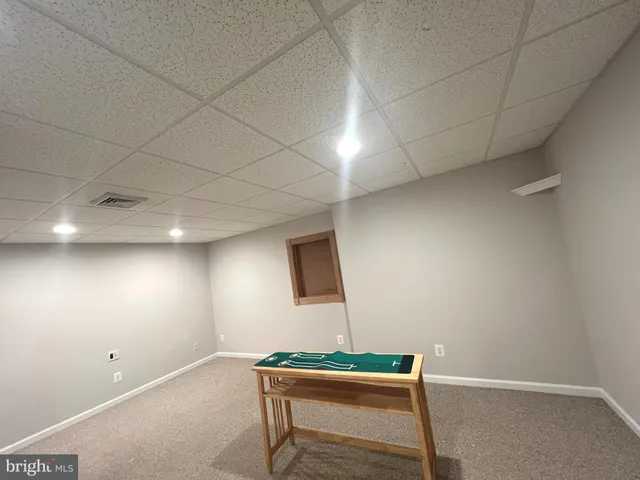 a room with furniture and wooden floor