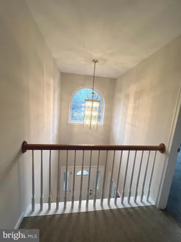 a view of staircase with rug floor