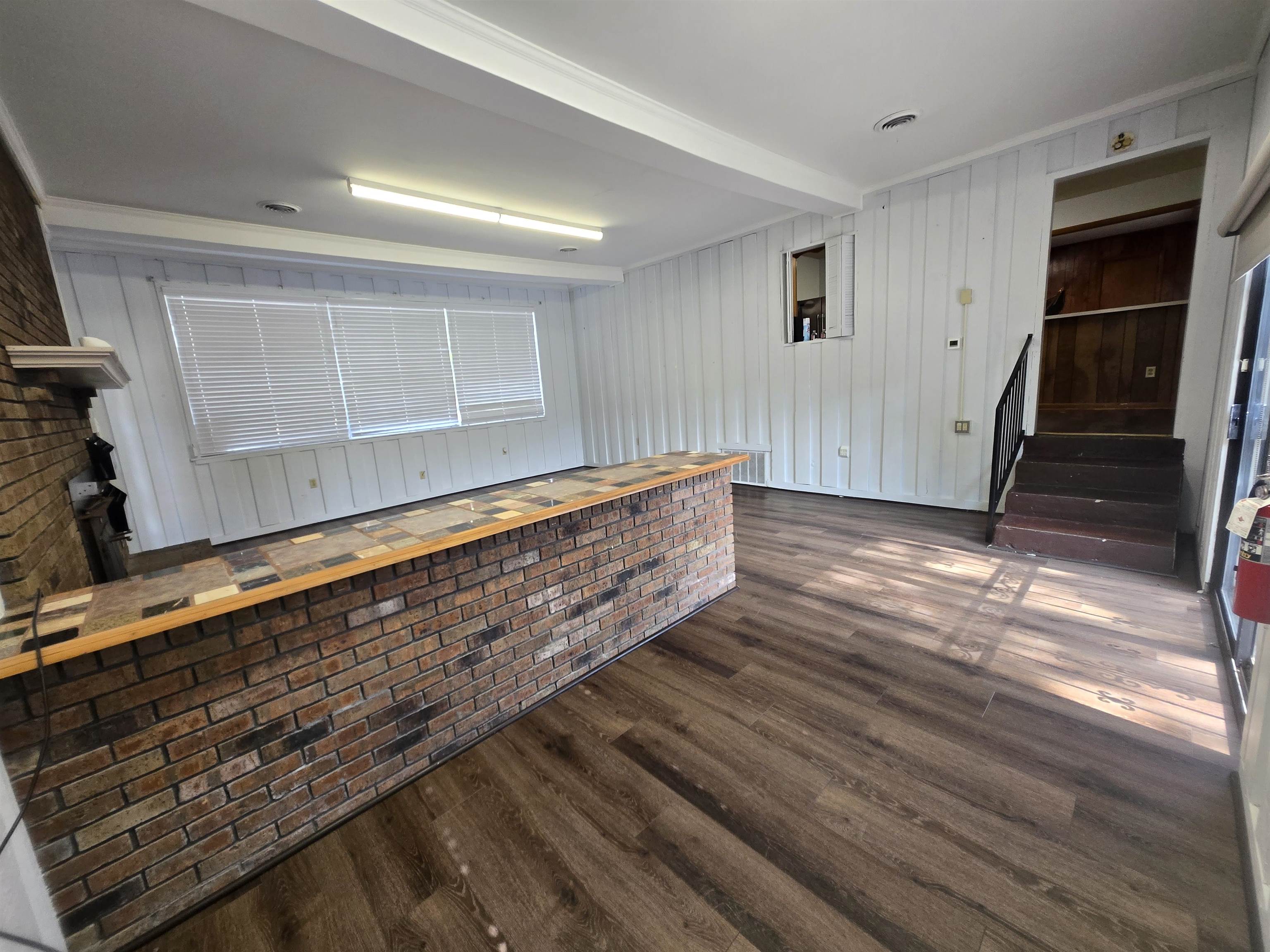 6855 Raleigh Lagrange Road Memphis, TN 38134 - Photo 11 of 13 a living room with hard wood floors and a window