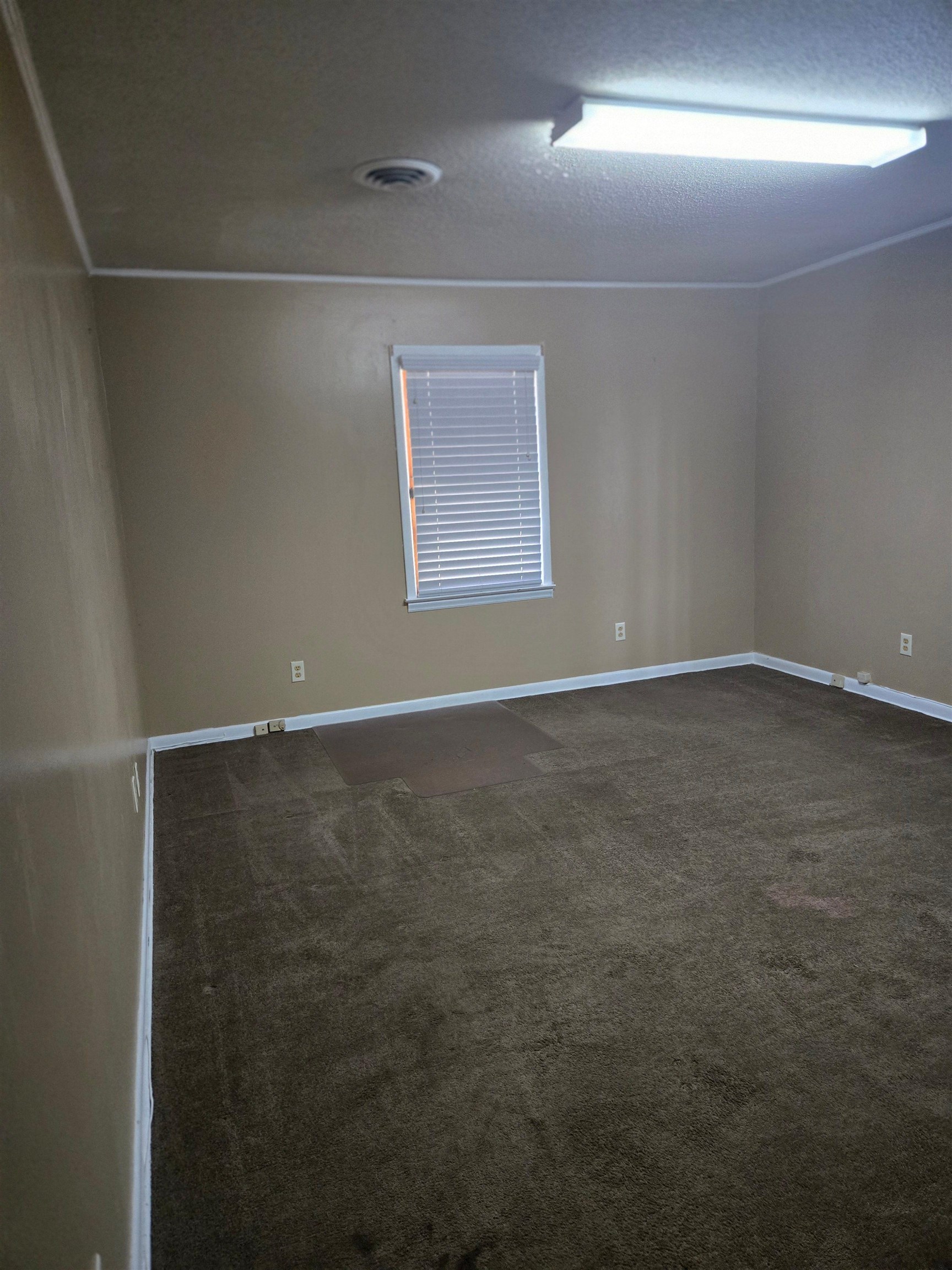 6855 Raleigh Lagrange Road Memphis, TN 38134 - Photo 4 of 13 a view of an empty room with window