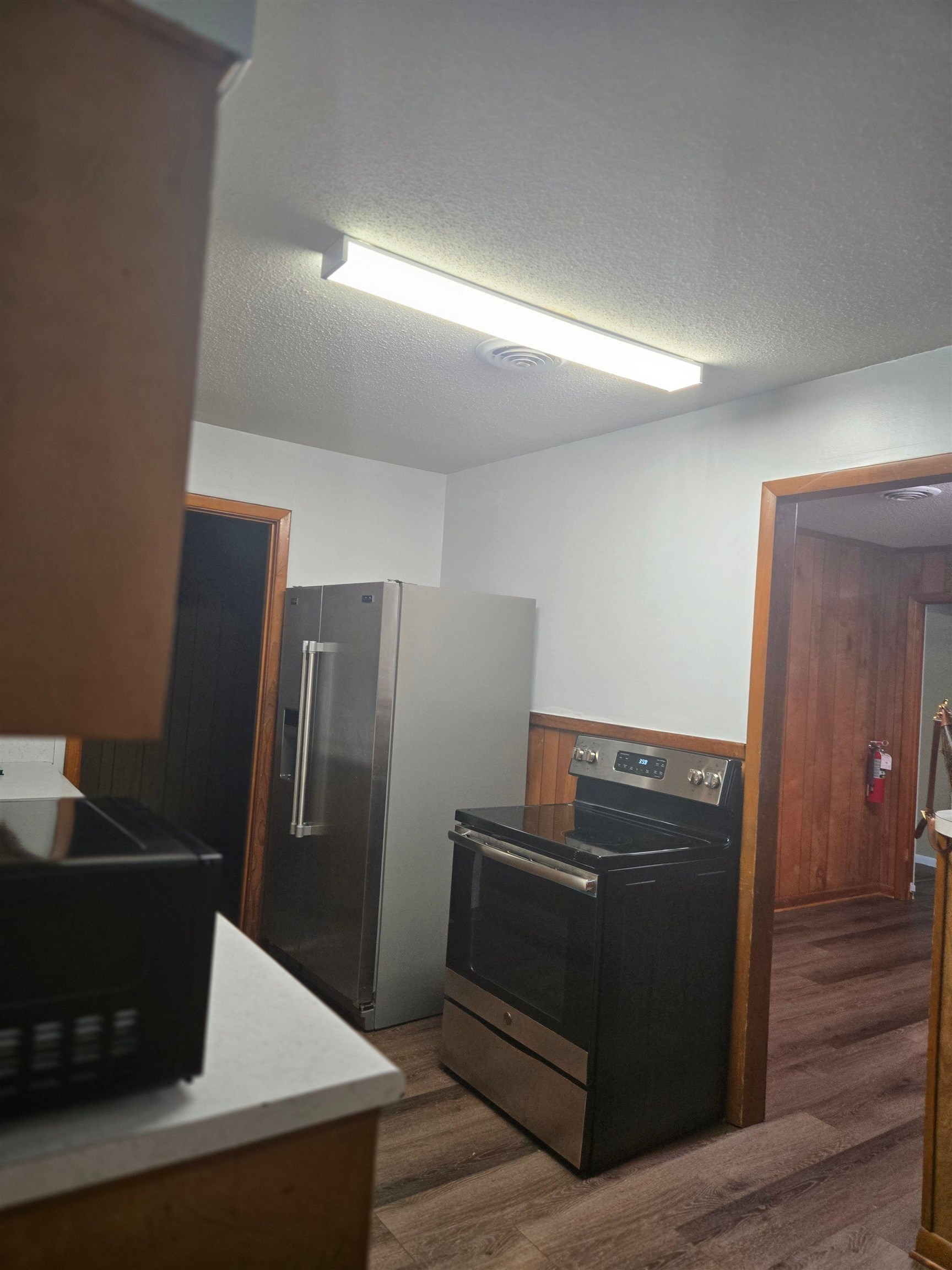 6855 Raleigh Lagrange Road Memphis, TN 38134 - Photo 10 of 13 a view of a refrigerator in kitchen and an empty room