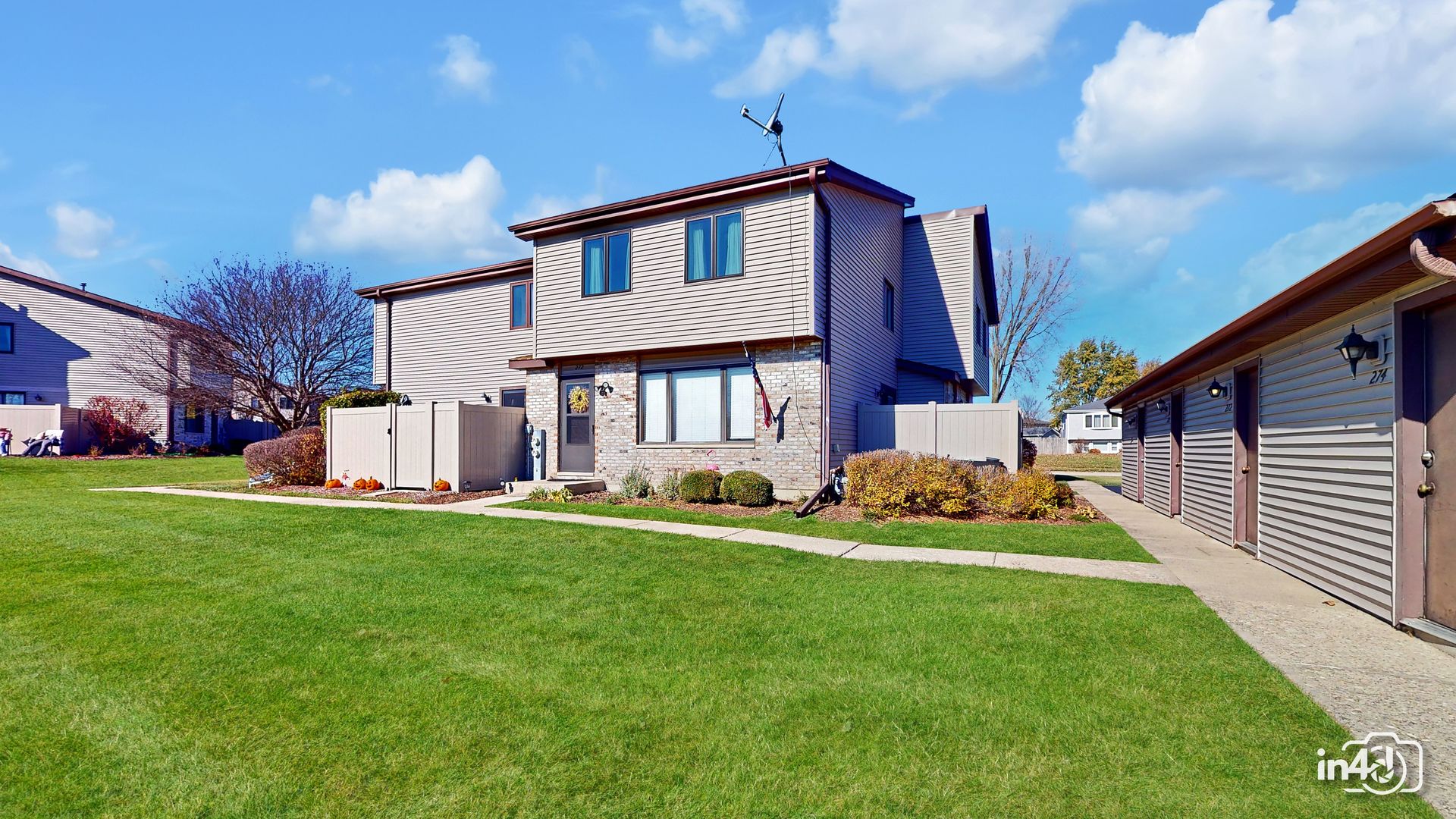 272 Circlegate Road New Lenox, IL 60451 - Photo 2 of 24 a front view of a house with a yard and garage