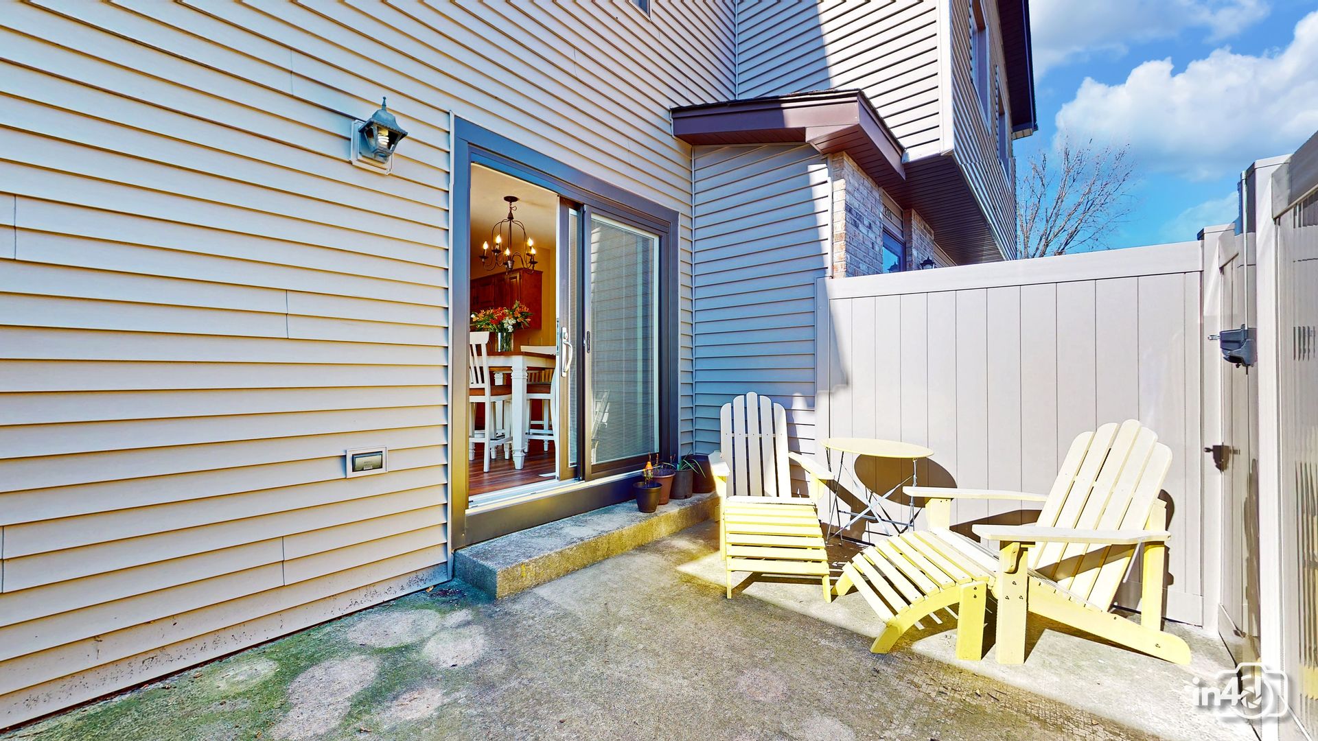 272 Circlegate Road New Lenox, IL 60451 - Photo 7 of 24 a view of a patio with table and chairs with wooden floor