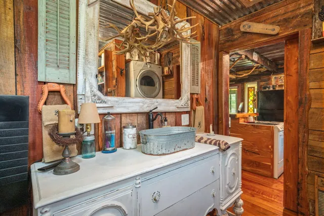 a bathroom with a toilet a sink and a mirror