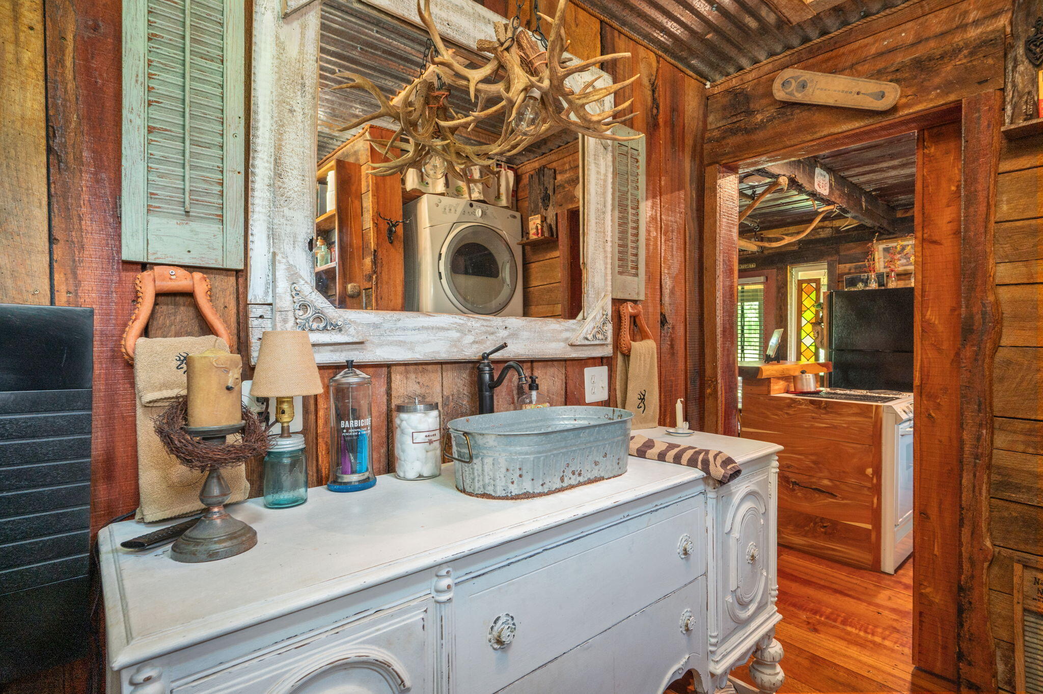 54 Wing Road Wing, AL 36483 - Photo 12 of 50 a kitchen with a stove and a wooden floor