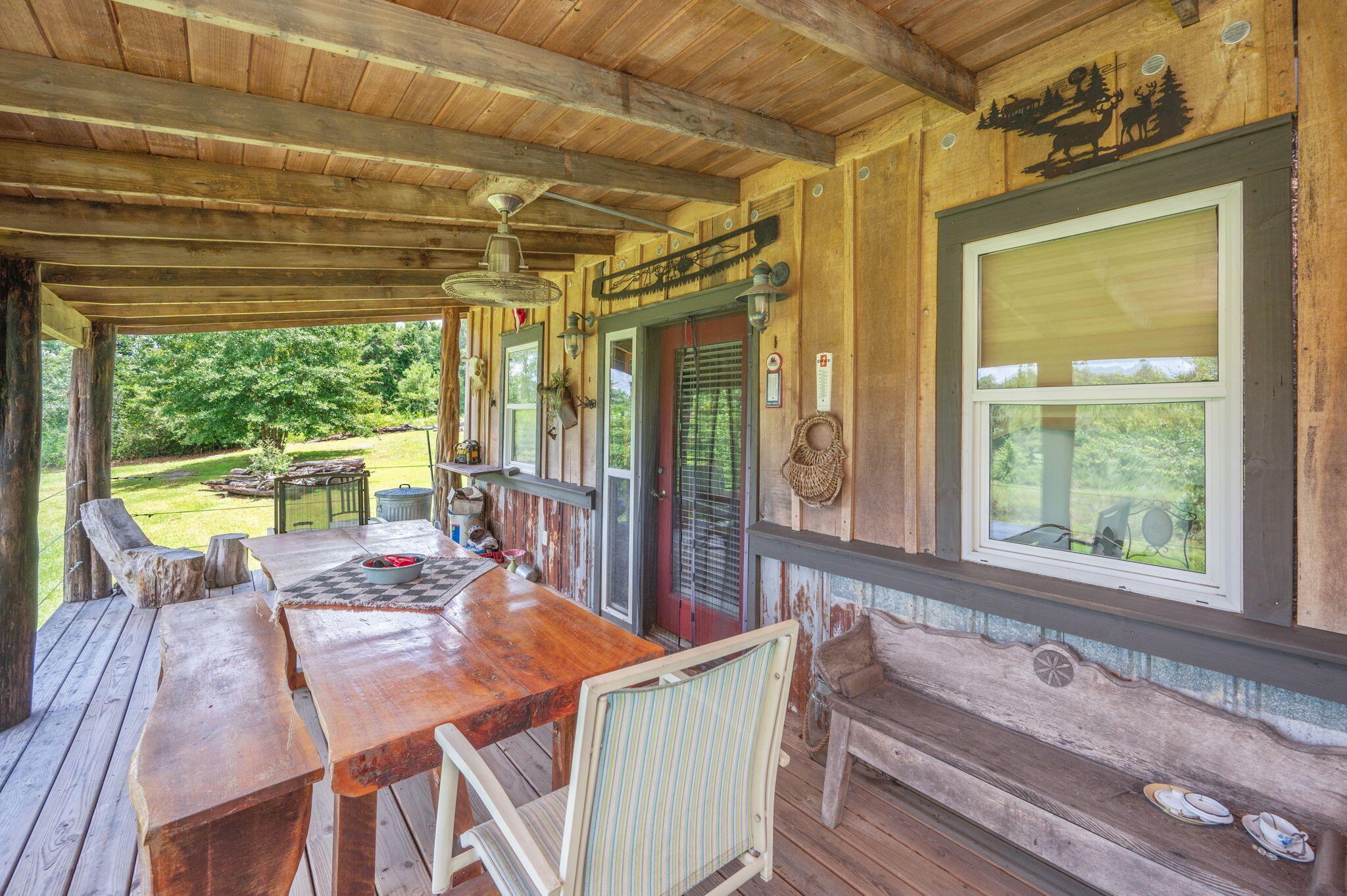 54 Wing Road Wing, AL 36483 - Photo 17 of 50 a view of a dining room with furniture large windows and wooden floor