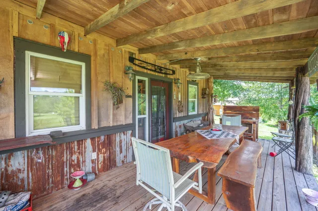 a view of a swimming pool with a yard