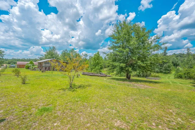a view of a house with a big yard