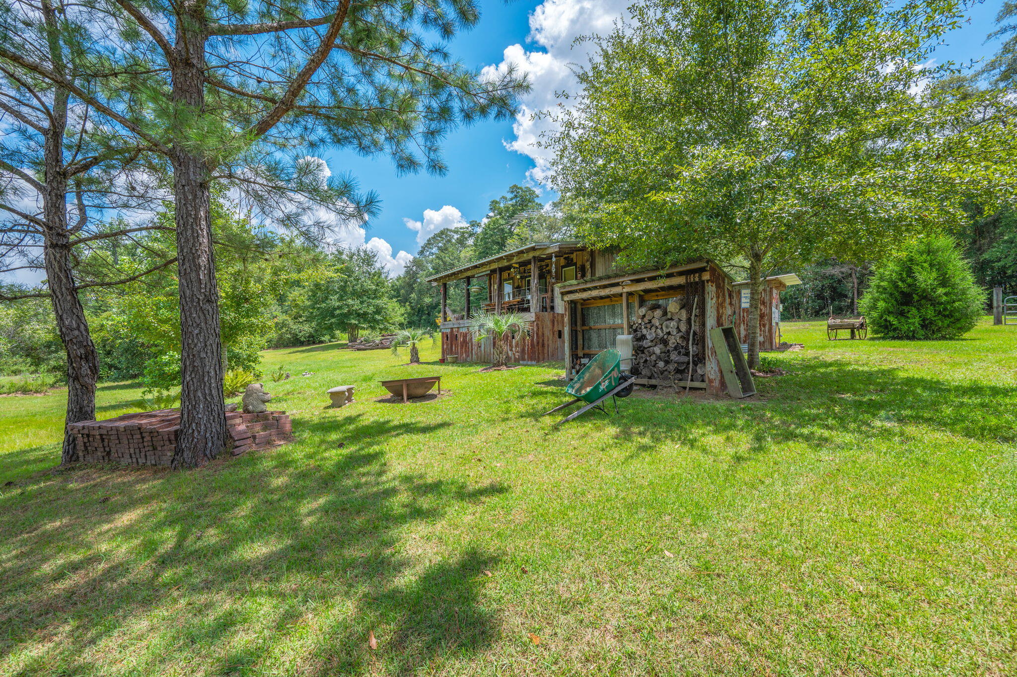 54 Wing Road Wing, AL 36483 - Photo 36 of 50 a view of a backyard with a small cabin