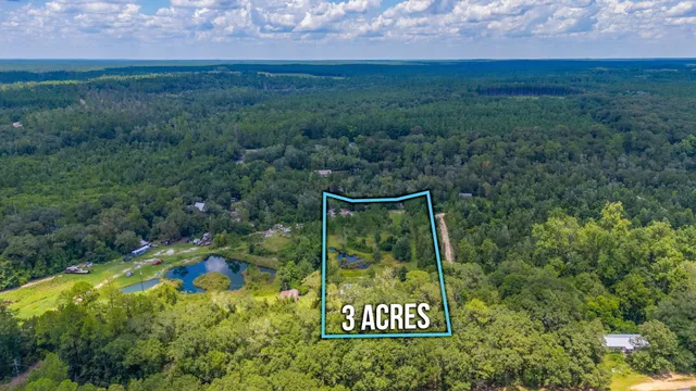 a view of a field with an outdoor space