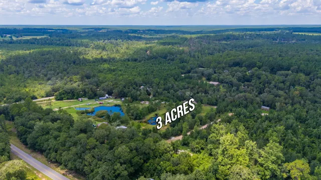 a view of a lake with a yard