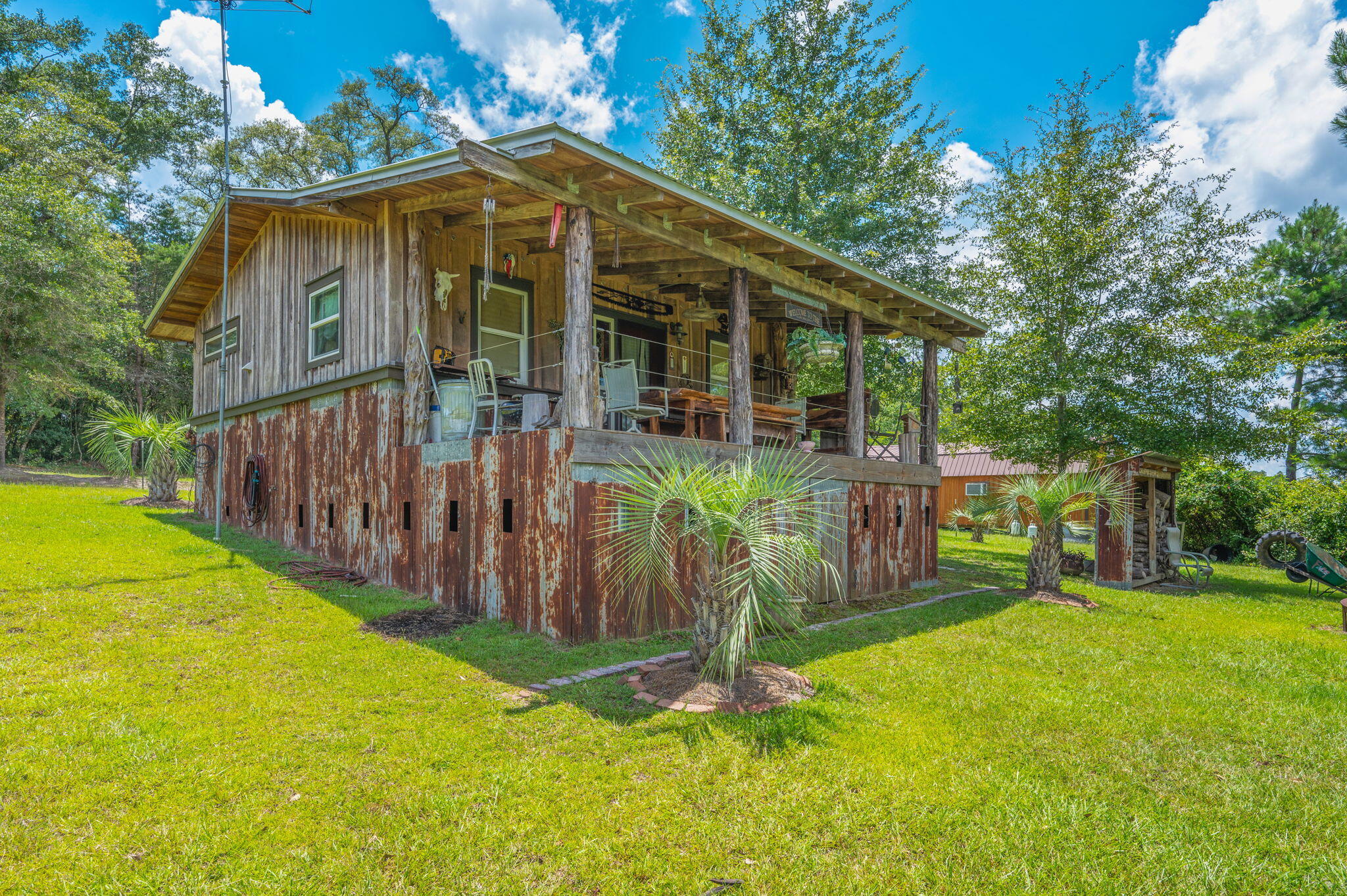 54 Wing Road Wing, AL 36483 - Photo 50 of 50 a view of a small yard in front of a house with wooden fence