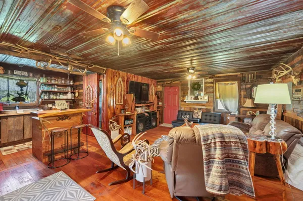 a living room with furniture and a flat screen tv