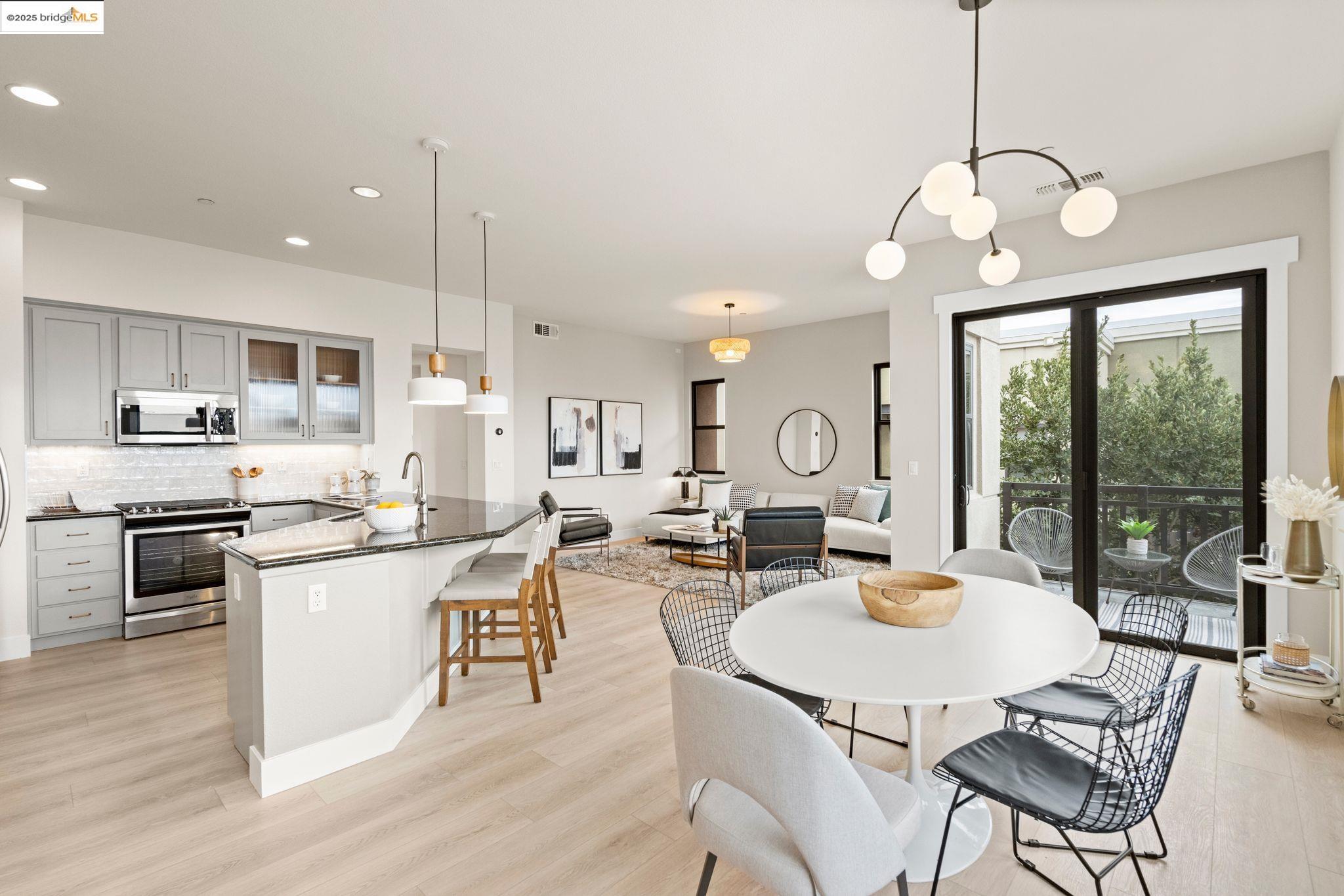 a large kitchen with a table and chairs