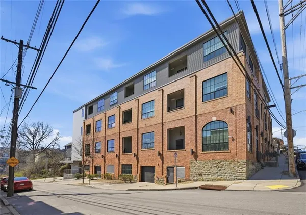 a front view of a building with street view