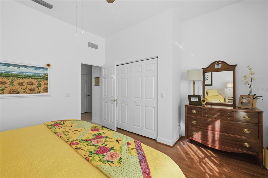 700 Southwest 89th Terrace Ocala, FL 34481 - Photo 22 of 94 a bedroom with a bed and wooden floor