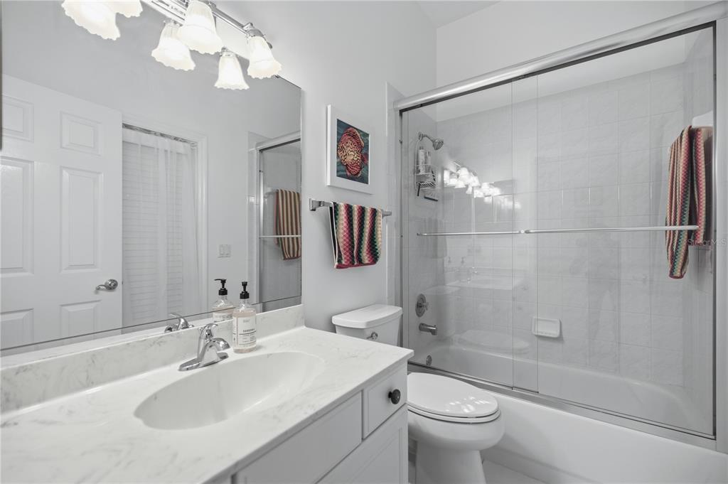 700 Southwest 89th Terrace Ocala, FL 34481 - Photo 26 of 94 a bathroom with a sink a toilet and shower