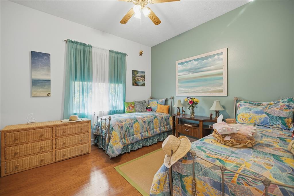 700 Southwest 89th Terrace Ocala, FL 34481 - Photo 27 of 94 a bedroom with two beds and a dresser