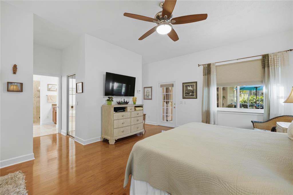 700 Southwest 89th Terrace Ocala, FL 34481 - Photo 31 of 94 a bedroom with a bed window and a flat screen tv