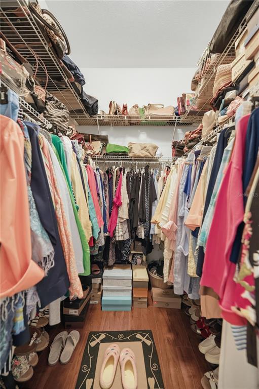 700 Southwest 89th Terrace Ocala, FL 34481 - Photo 33 of 94 a view of walk in closet with clothes and shoes