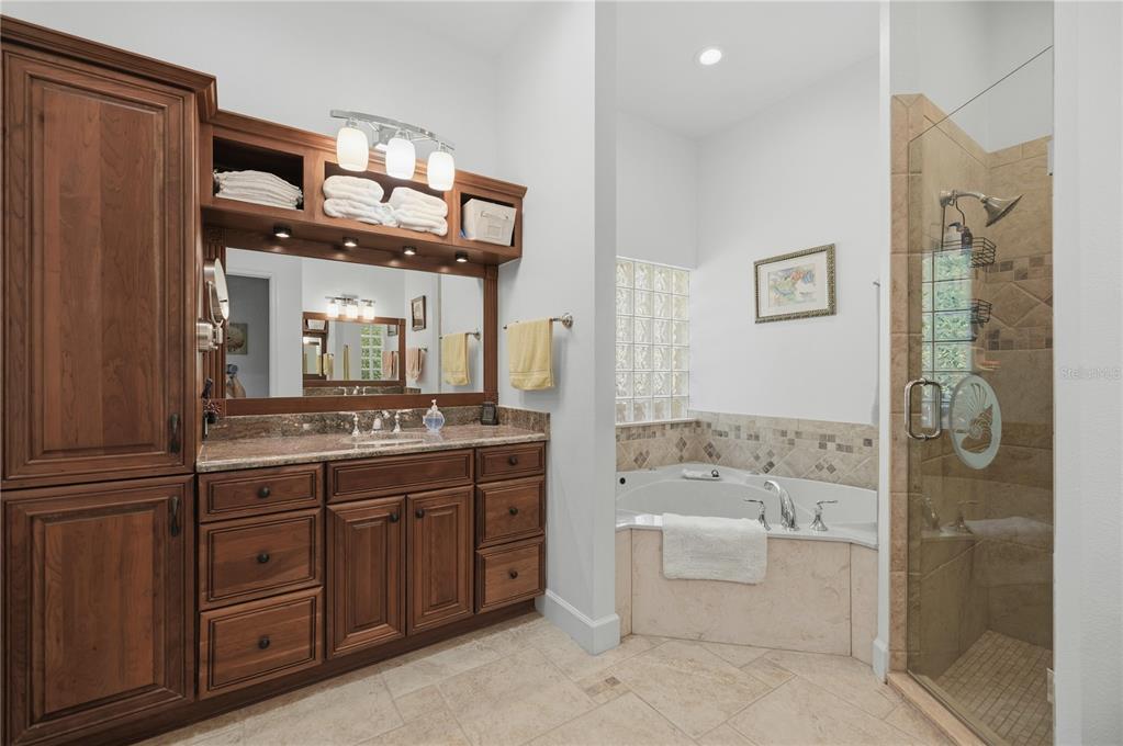700 Southwest 89th Terrace Ocala, FL 34481 - Photo 34 of 94 a spacious bathroom with a tub sink and mirror