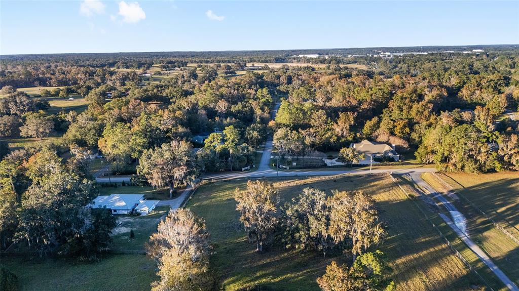 700 Southwest 89th Terrace Ocala, FL 34481 - Photo 94 of 94 an aerial view of a house with a yard and lake view