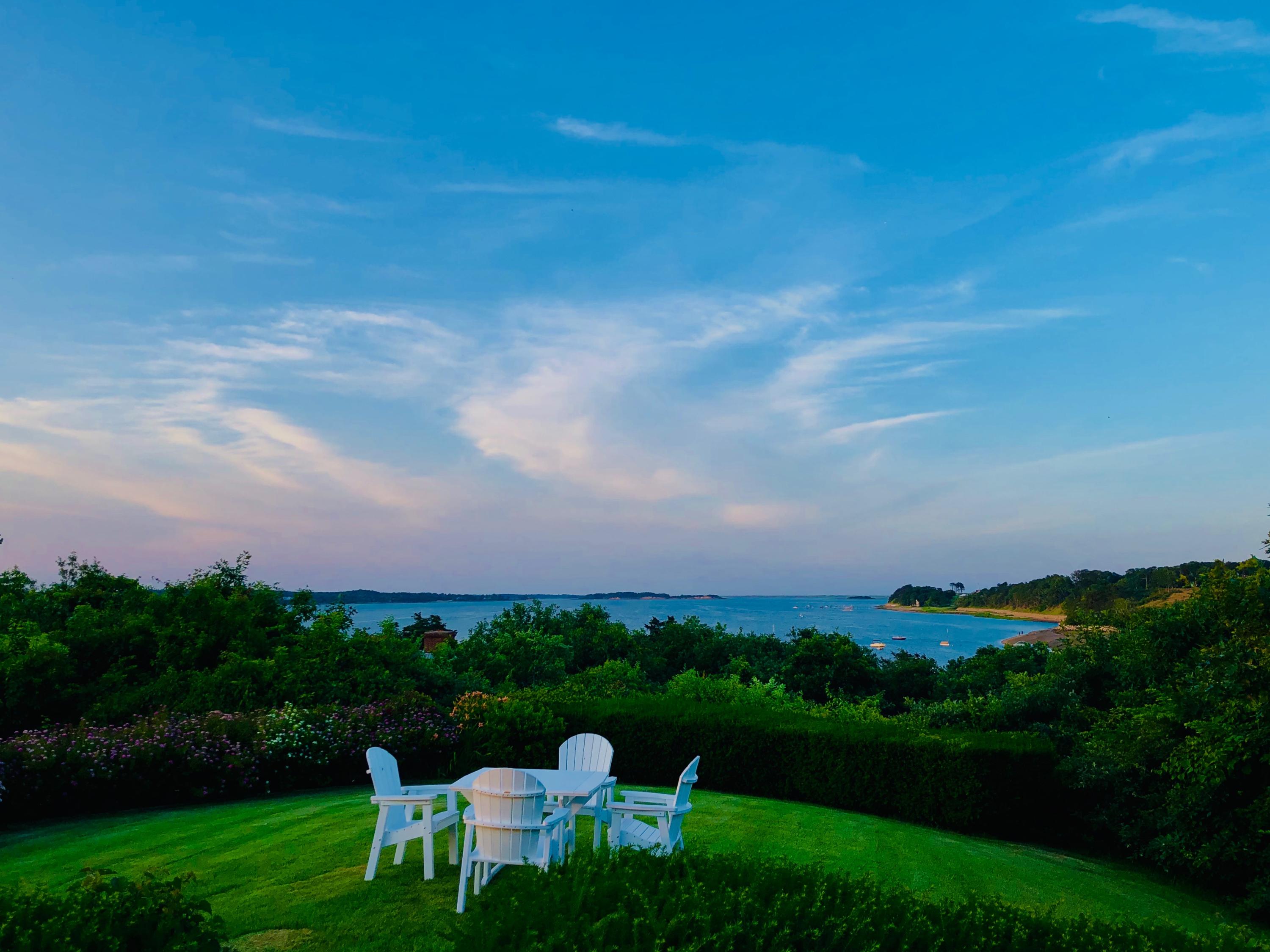 a view of a table and chairs in the garden
