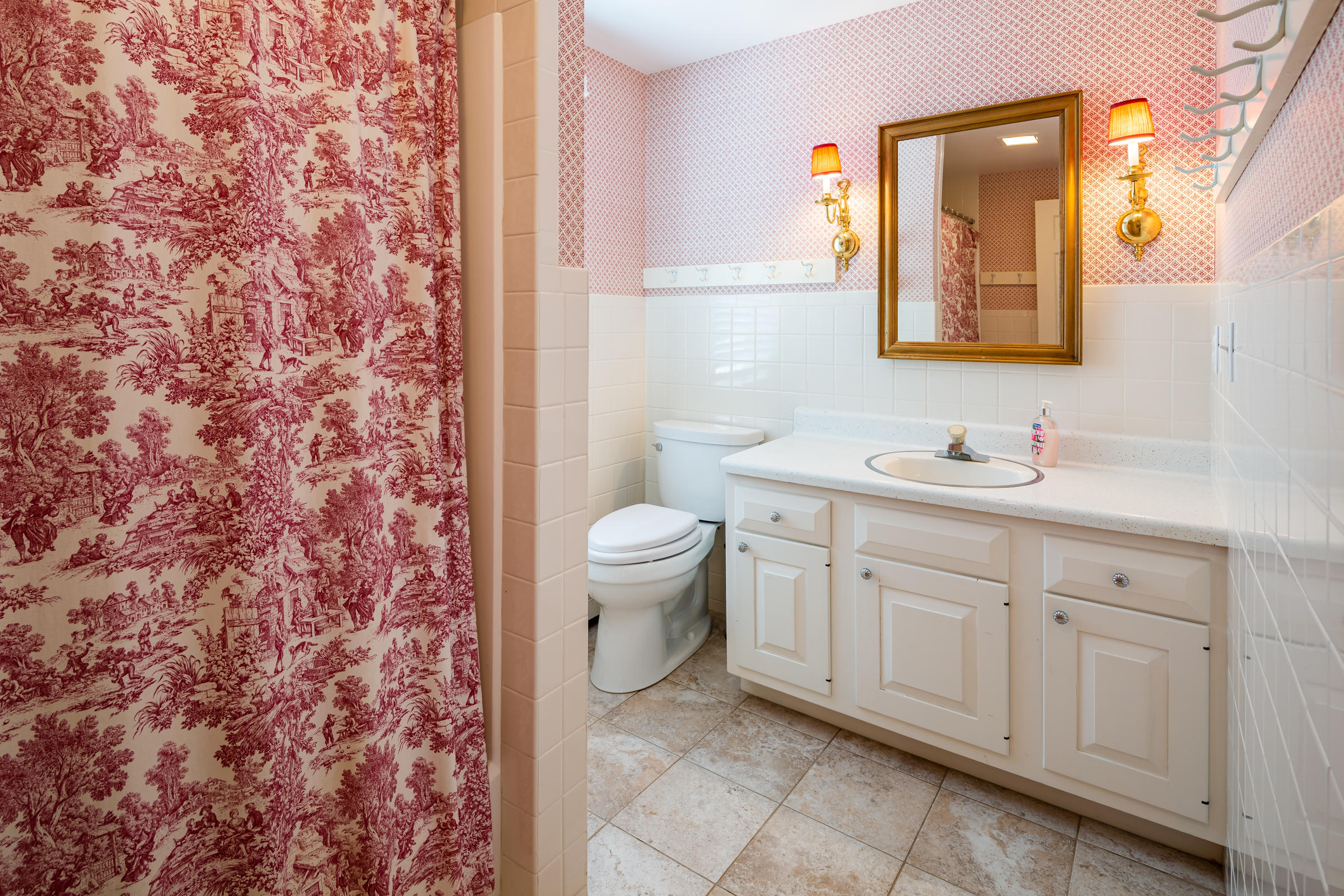 265 Bay Road Harwich, MA 02645 - Photo 16 of 38 a bathroom with a granite countertop sink a toilet and a mirror